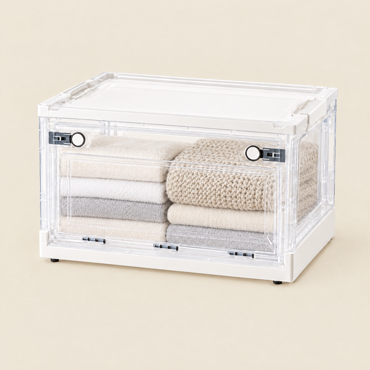 Fuho collapsible transparent storage box with side doors, holding folded towels and a blanket