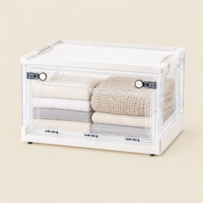 Fuho collapsible transparent storage box with side doors, holding folded towels and a blanket