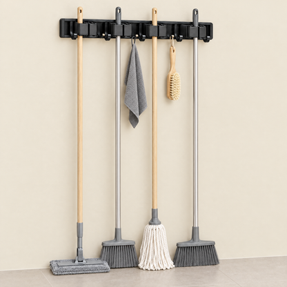 Fuho MopDock wall-mounted holder with a flat mop, two brooms and a string mop